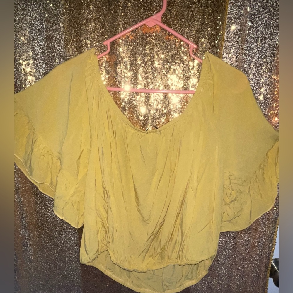 Gold short off shoulder blouse.